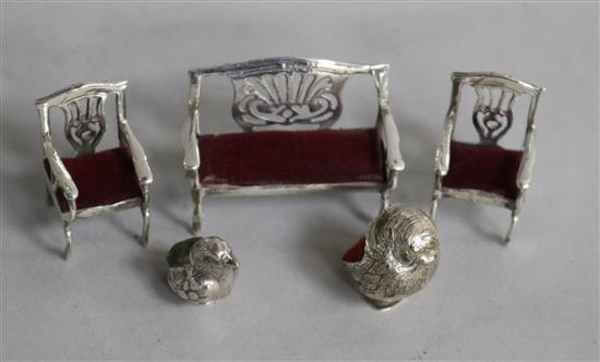 An Edwardian silver chick pin cushion, Birmingham 1910, Levi & Salaman, a later 925 example and a miniature salon suite,